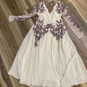 Beautiful embroidered dress with mesh sleeves